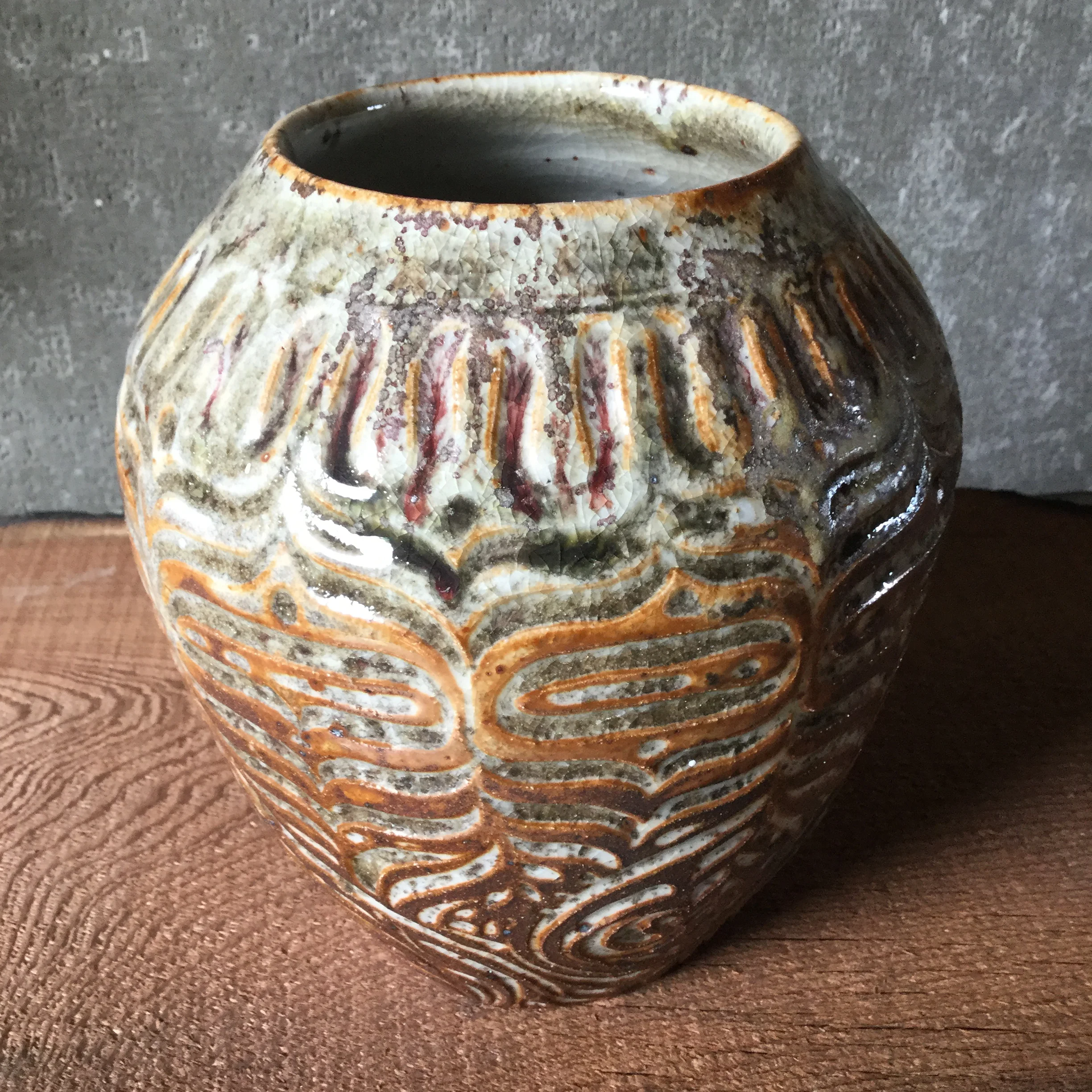 Penn state shino with heavy dose of wood ash applied while glazing.