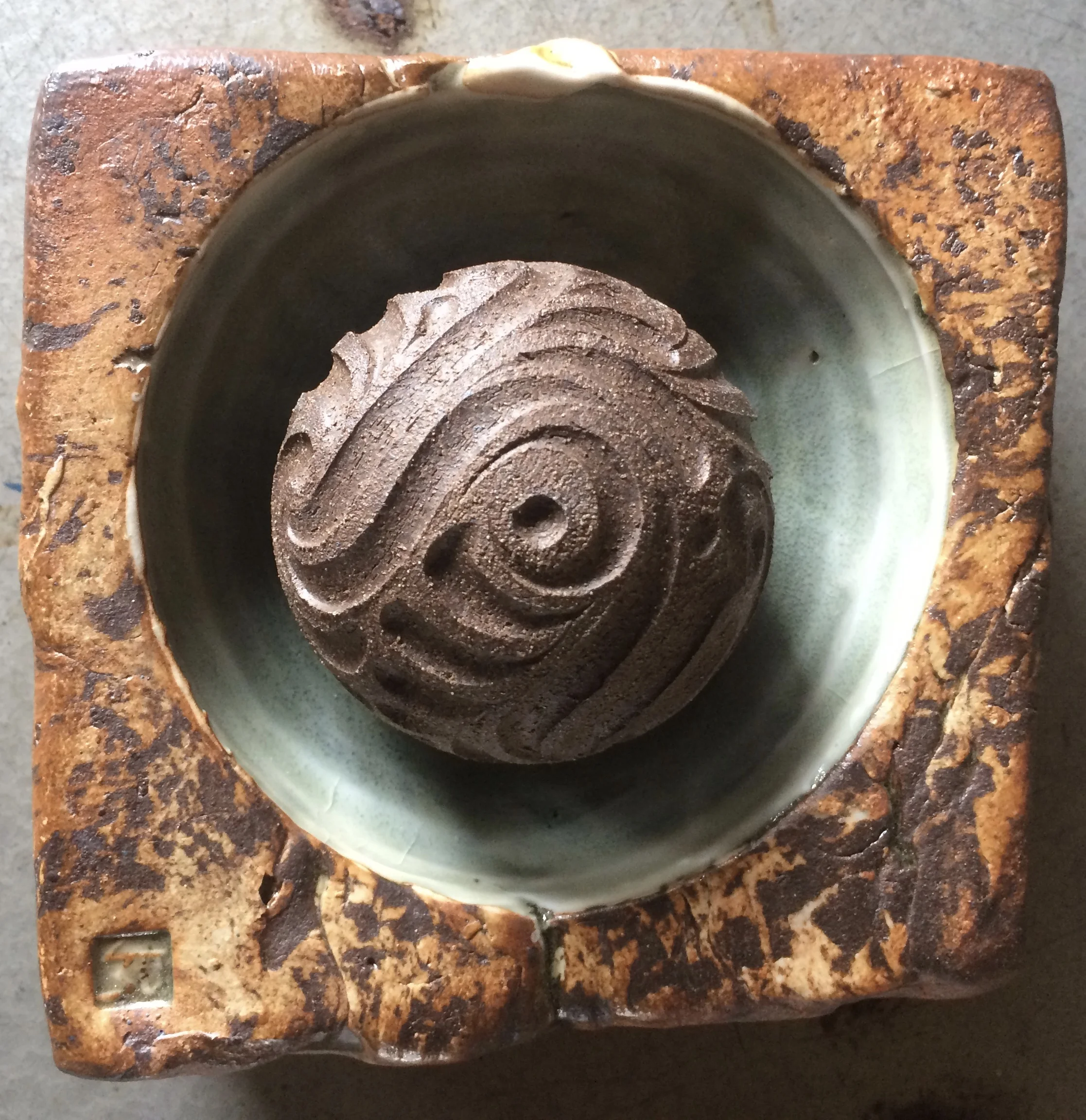 Black Mountain carved sphere in a salt pinch.