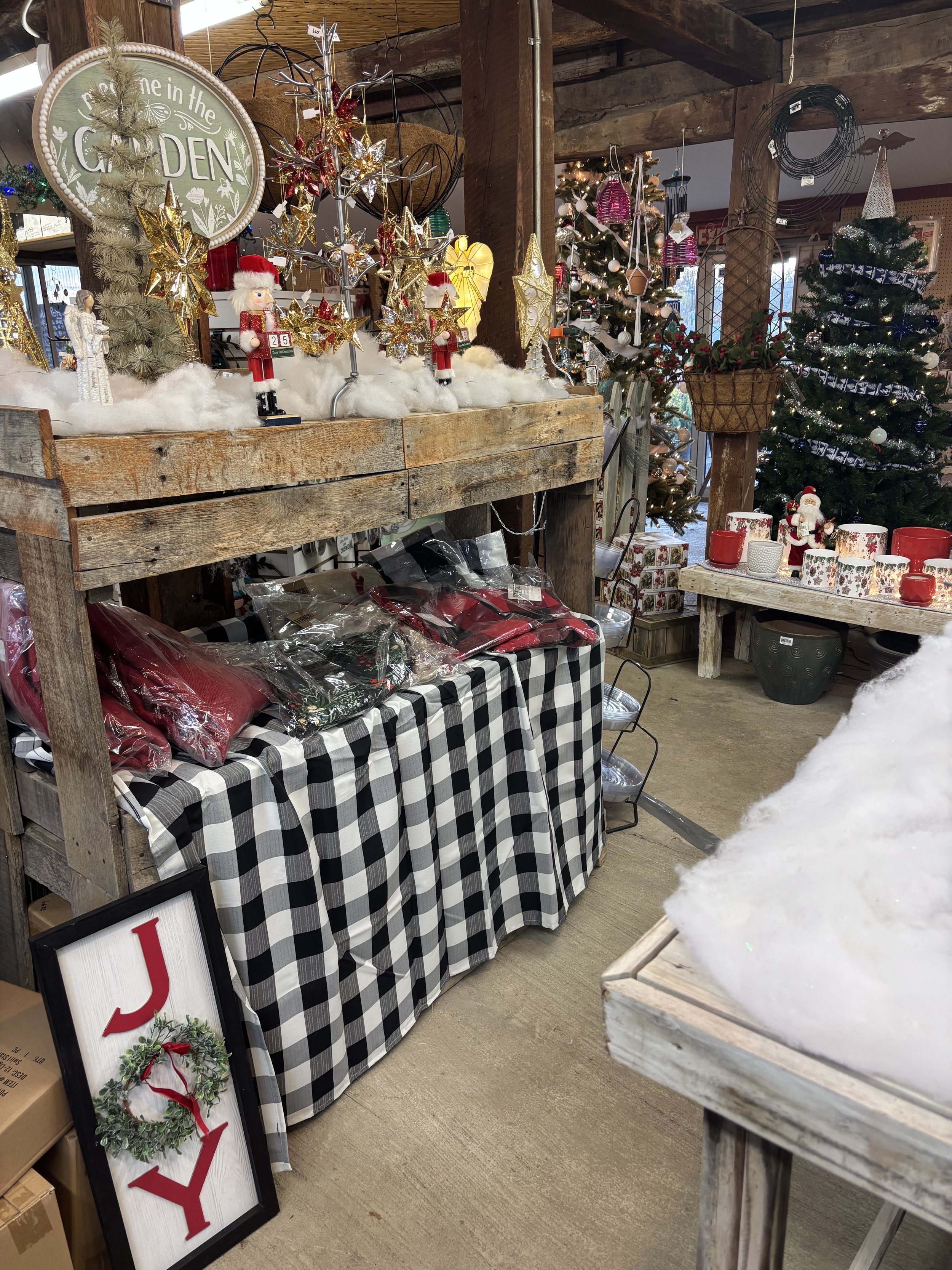 Interior of Lovell's Nursery Christmas shop featuring Christmas toppers, skirts, and ornaments
