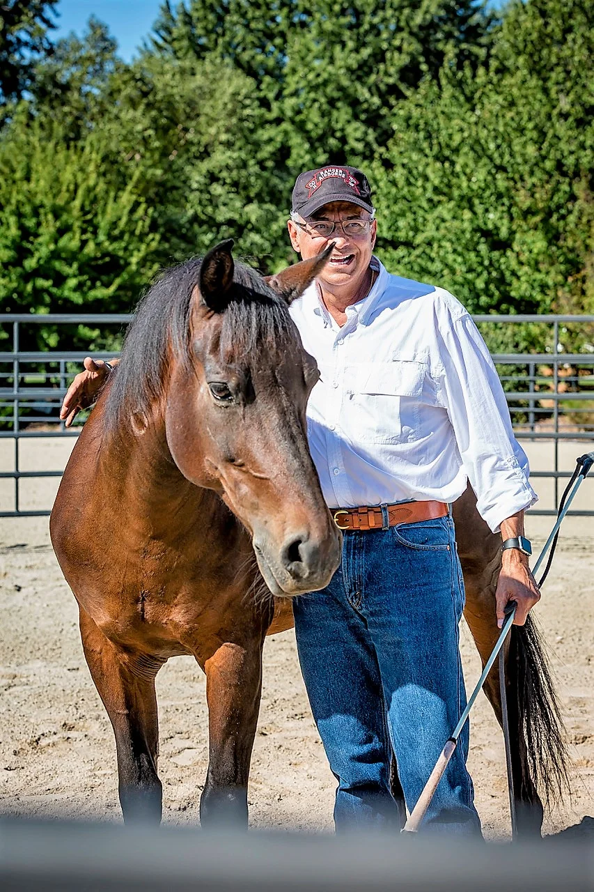 A U.S. army Ranger and Vietnam Veteran smiles after completing his first round pen session. Many participants say they are finally able to exhale and smile again through their work with horses. Photo by: SilverStar Classic Photography