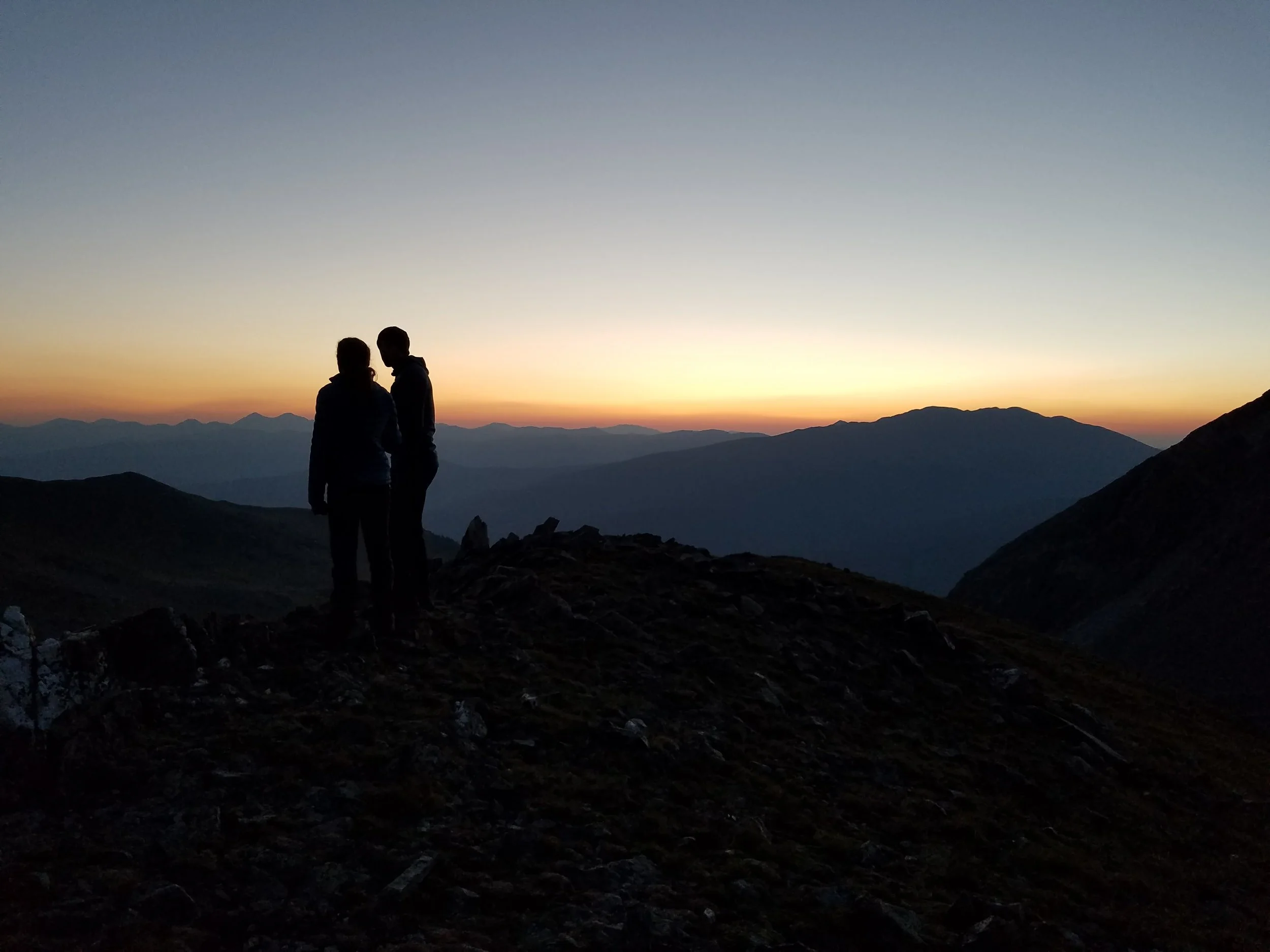 Owen and Emily enjoying the pre-dawn view of Summit County from the East Ridge of Father Dyer. Photo: Mike Hasse