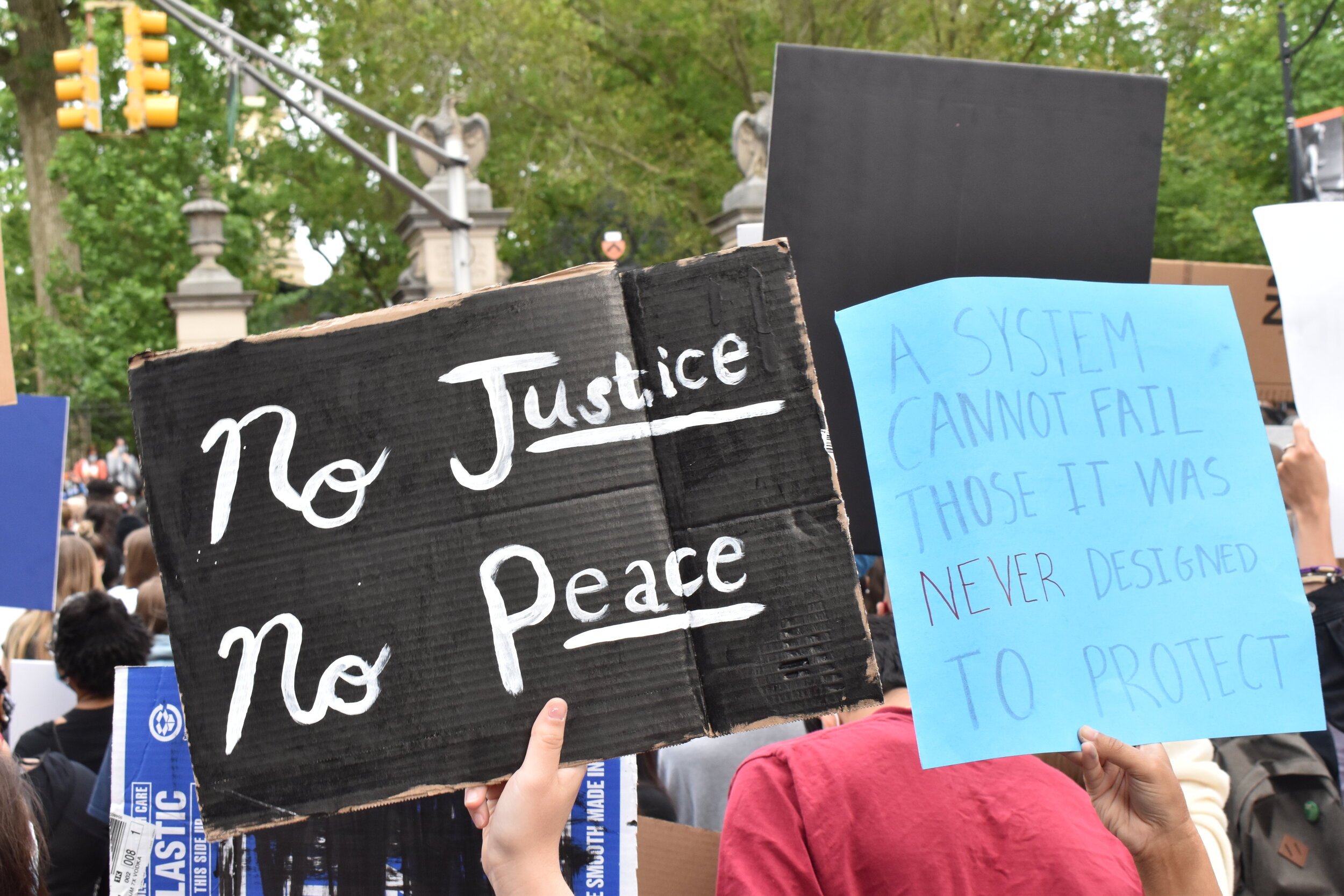  Protestors held up signs at a rally in Princeton, New Jersey on Tuesday, June 2, 2020.  Photo by: Madison Mento  