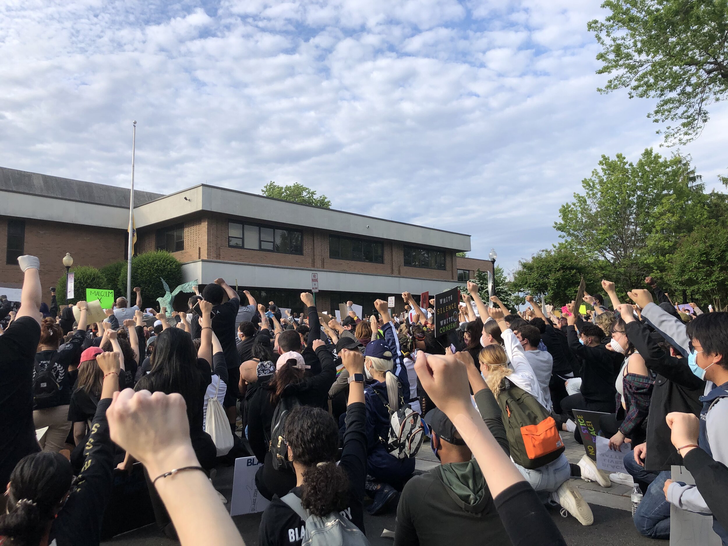  Protestors raised their fists, a symbol of solidarity, outside of City Hall in Clifton, New Jersey on Tuesday, June 2, 2020.  Photo by: Gab Varano  