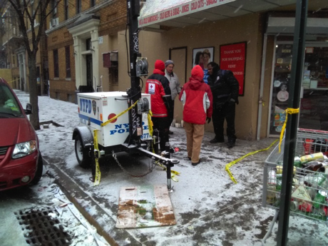 Red Cross workers on scene talking with displaced tenant.