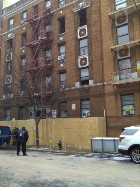 Displaced tenant looks on two days after re. All photos by Leonel Henriquez.