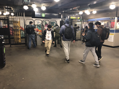 Lehman College students exiting the 4 train at Bedford Park Station. Photo by Hector Bello.