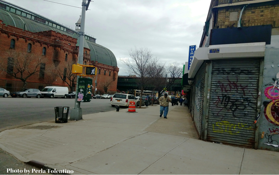 Businesses across the north side of the armory currently without a lease. The closed gate on the corner is the second market Patrick Lim was forced to close. Photo by Perla Tolentino. 