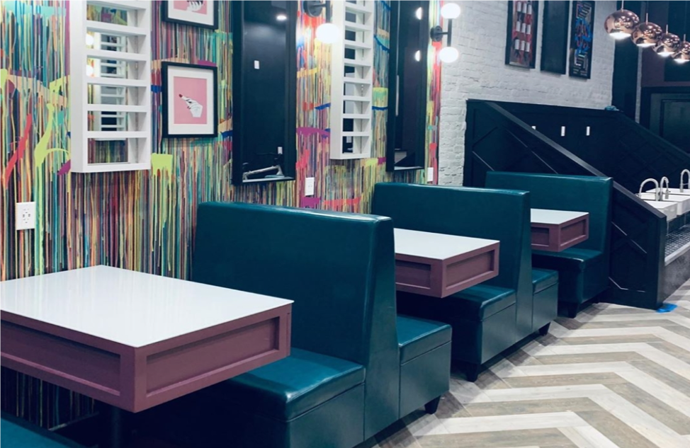  With retro-looking restaurant seats and appearance, nail technicians can interact with their clients like friends having a casual meal.  (Photo Credit: Nail Drip NYC)  
