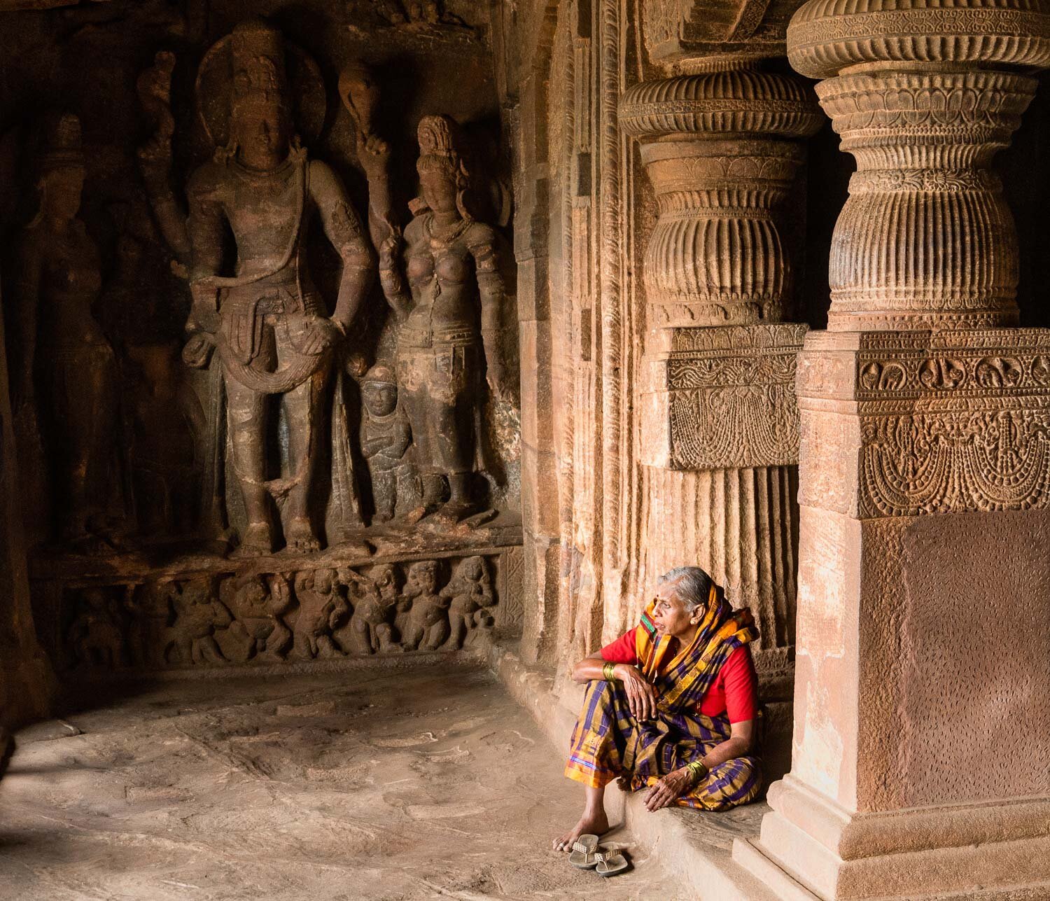 Old woman at Badami Cave Temple, India