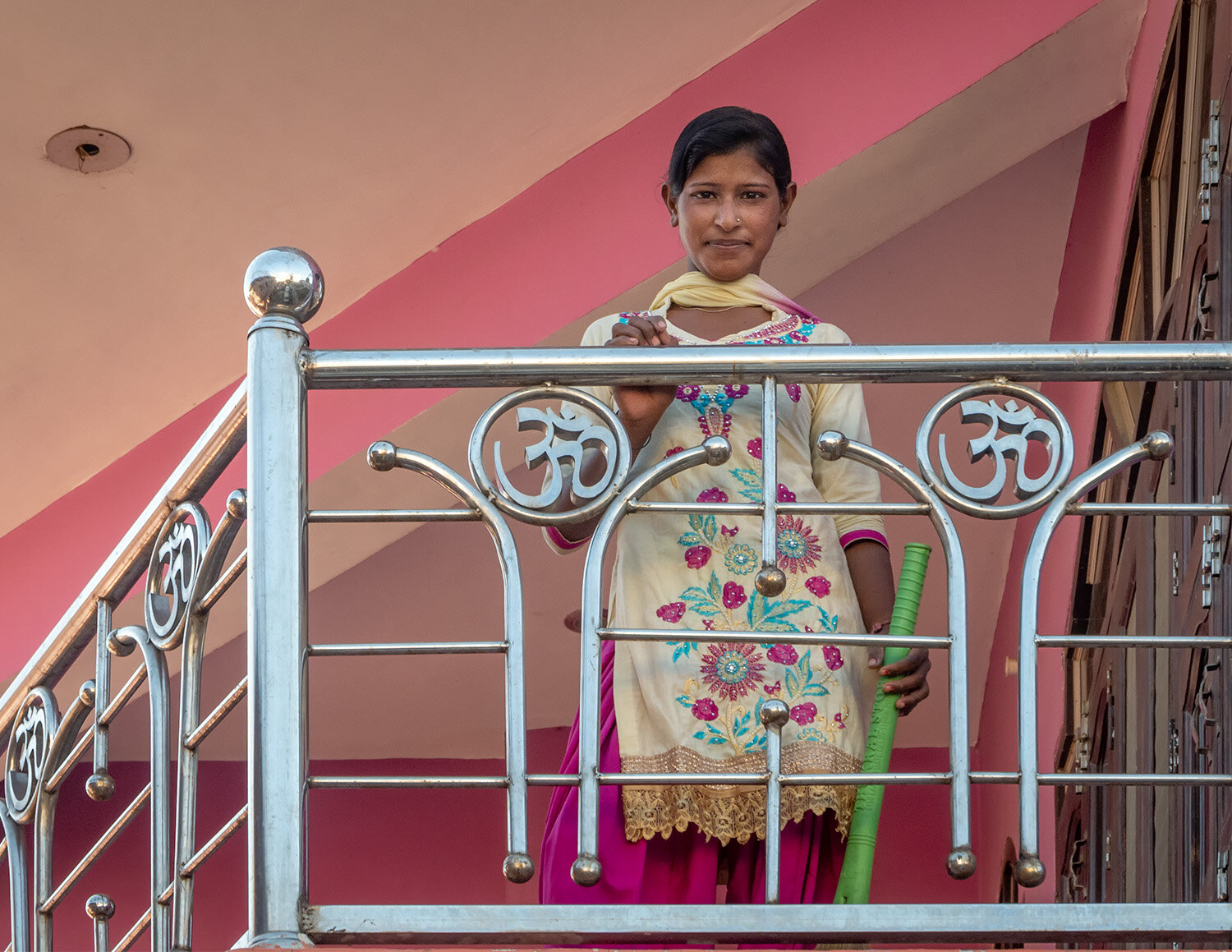 Young woman on a balcony, Nandgaon, India