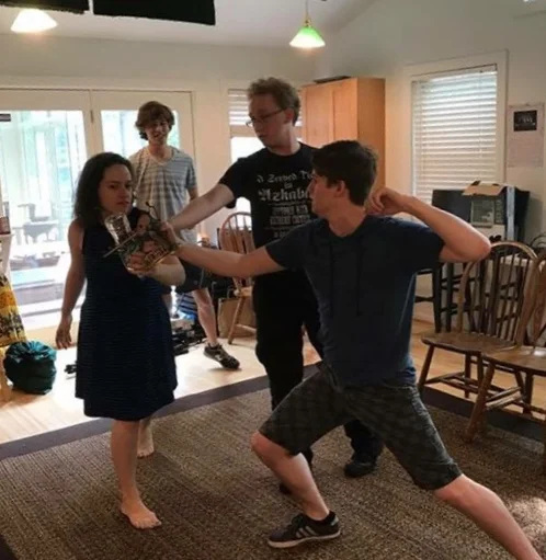 Ian Claar works with actors on a fight using found objects for J-Swizzle and D-Man’s Epic Awesome Swaggy Broventure for Sweet Rhymes (Dodgeball Theatre, DC Fringe, 2017)