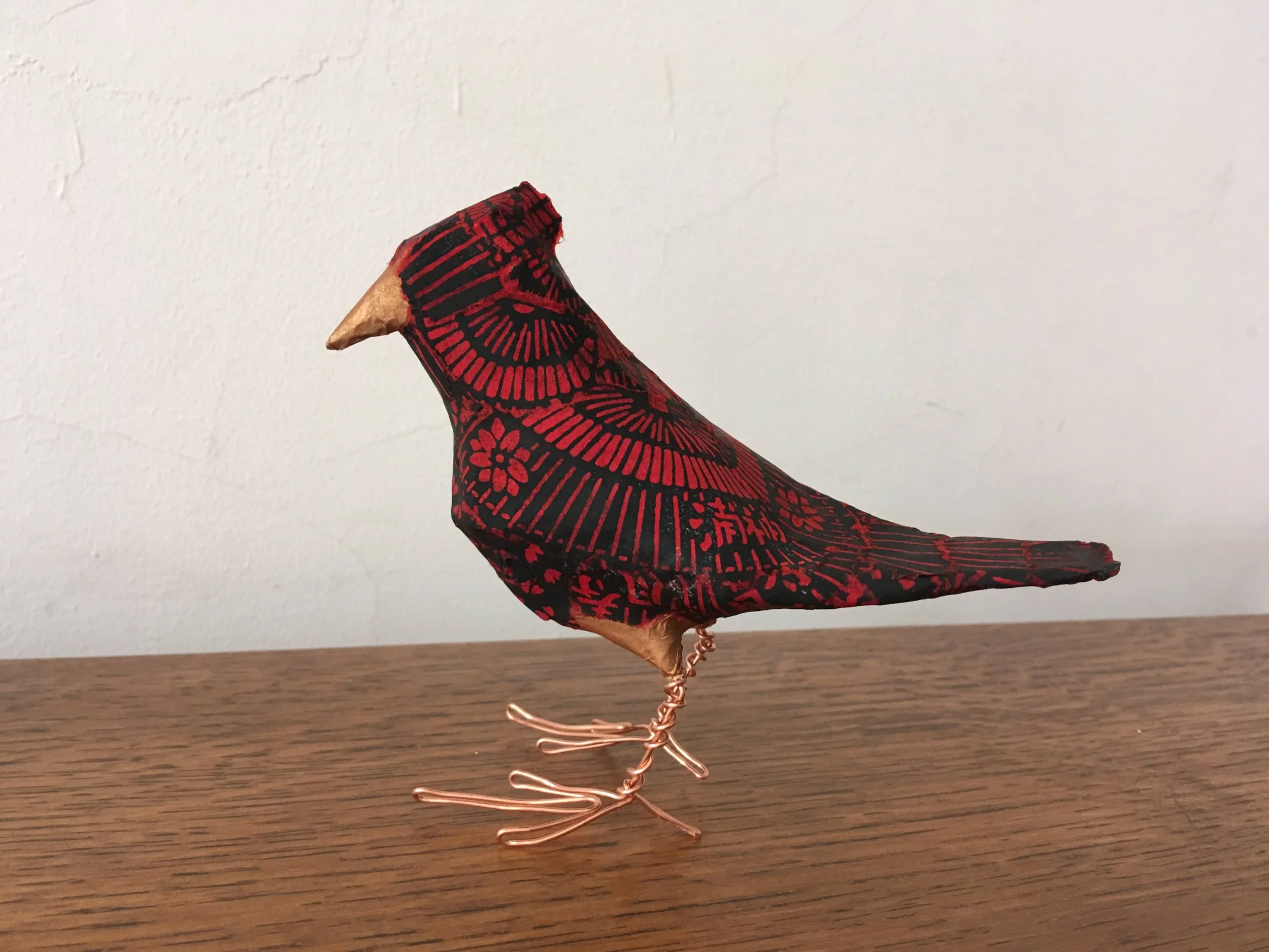 Japanese tsutsumi dark cardinal bird