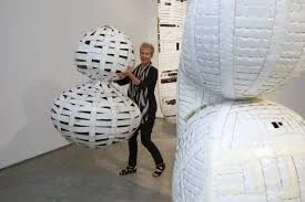 Artist Ann Weber makes large-scale sculptures out of corrugated cardboard - she uses a huge amount of material! Maybe you can work on a slightly smaller scale. Here is a link to images from a workshop she taught in 2011 .