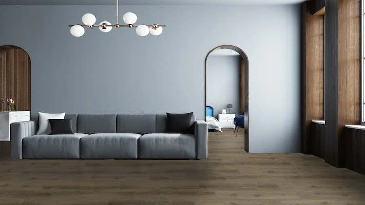 Modern Gray Living Room Interior With A Gray Sofa, Narrow Doorways And A Wooden Floor. 3d Rendering 