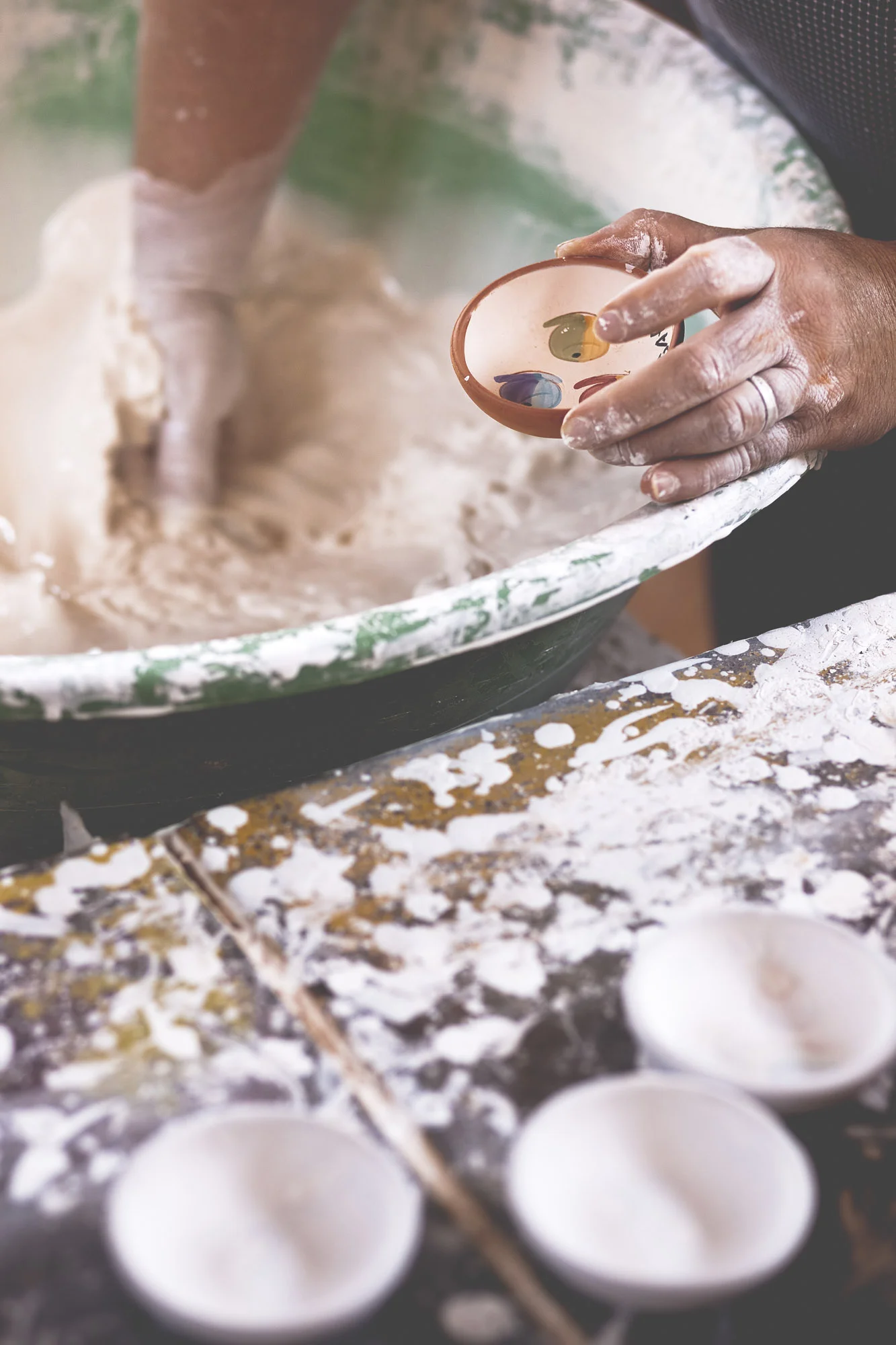 Artisan treating and painting the ceramics in Sao Pedro do Corval