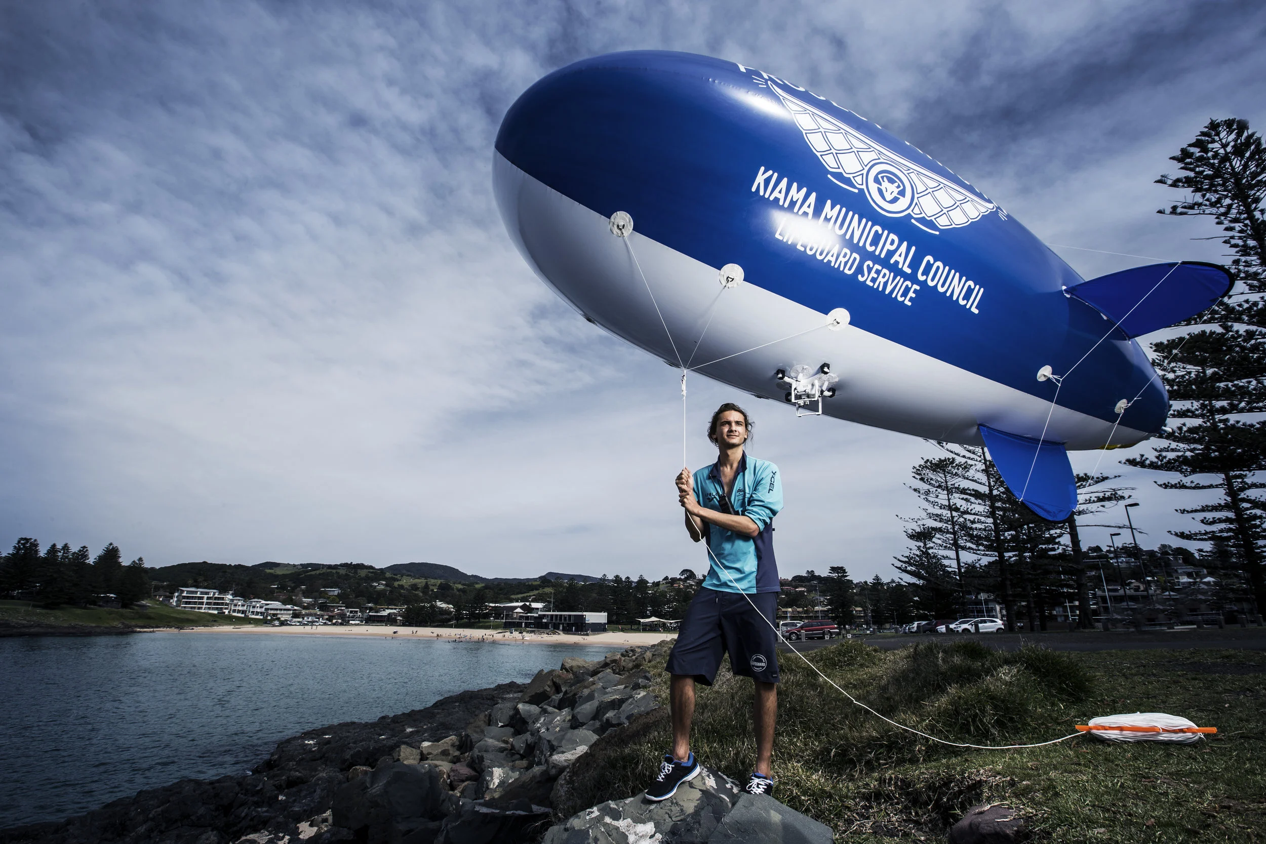 Lifeguard and marine biologist Kye Adams at Kiama Beach, NSW, with his blimp-mounted camera system for spotting sharks