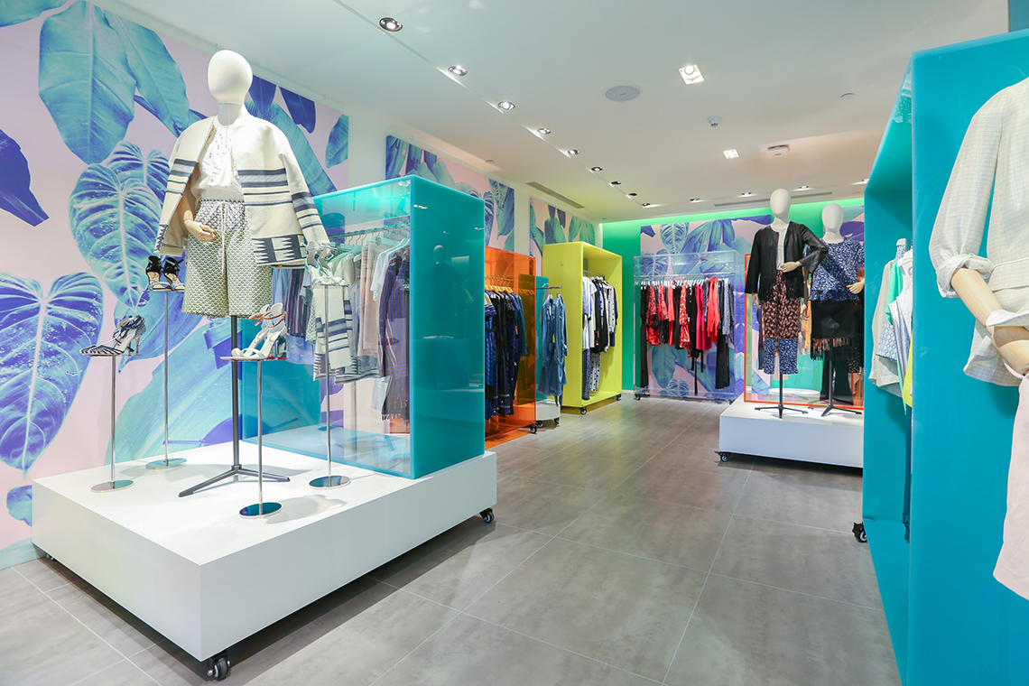 Shanghai Times Square Womenswear, featuring wall prints by an overseas artist.