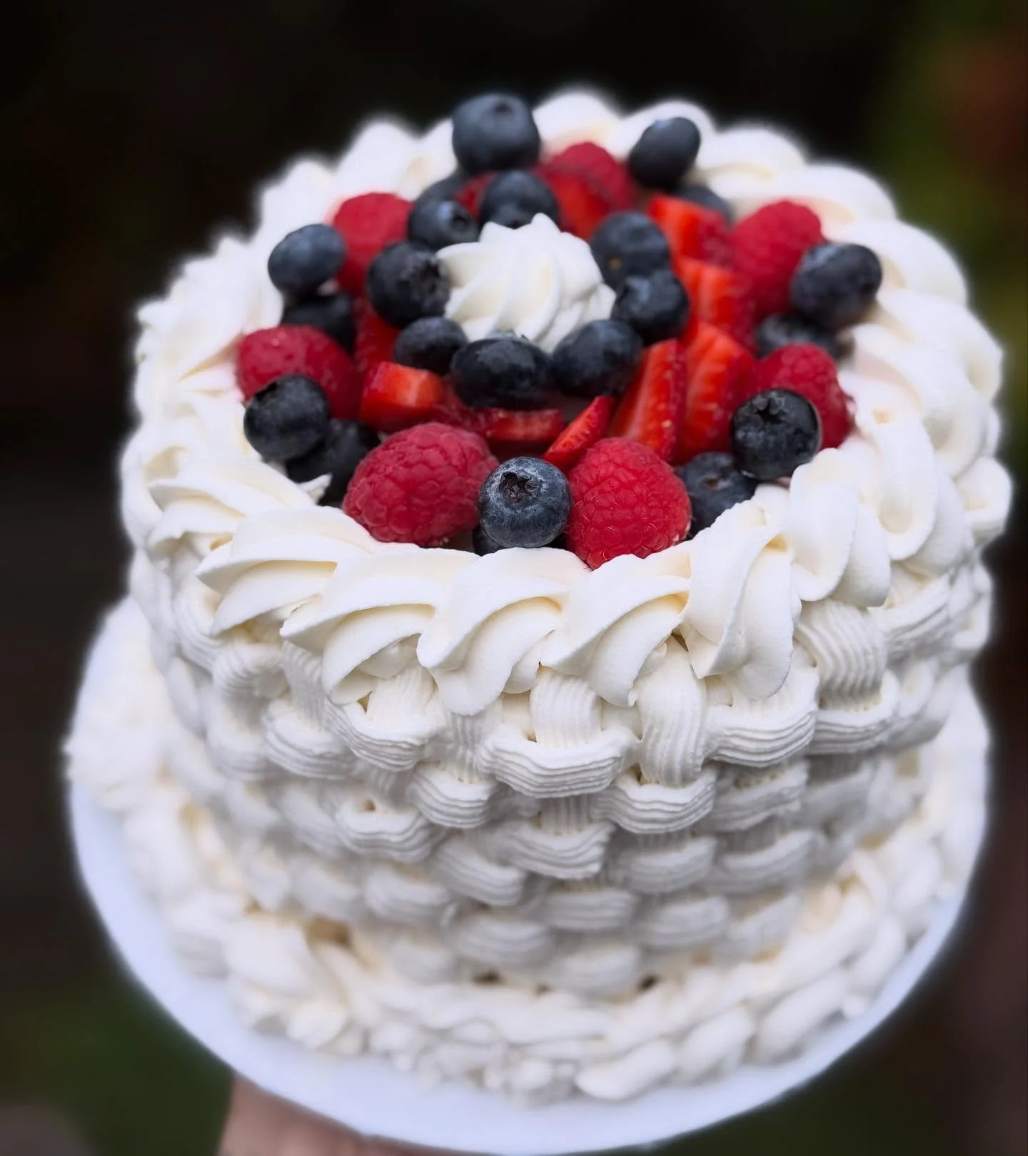 A fruit basket cake! She is a vanilla cake layered with berries &amp; pastry cream and covered in chantilly cream. 😉🤤 
.
.
Puts a whole different spin on fruit cake doesn&rsquo;t it?? 
.
#hellodelicious #pdxcakes #portlandbakery #beavertoneats #bea
