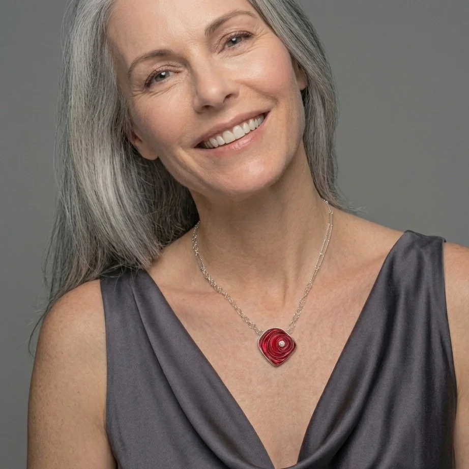 red-orbit-ripple-glass-necklace-with-topaz-on-model.jpg