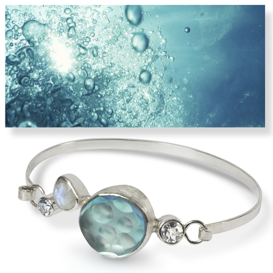 Sterling silver, glass, moonstone, Swiss blue topaz, and white topaz.