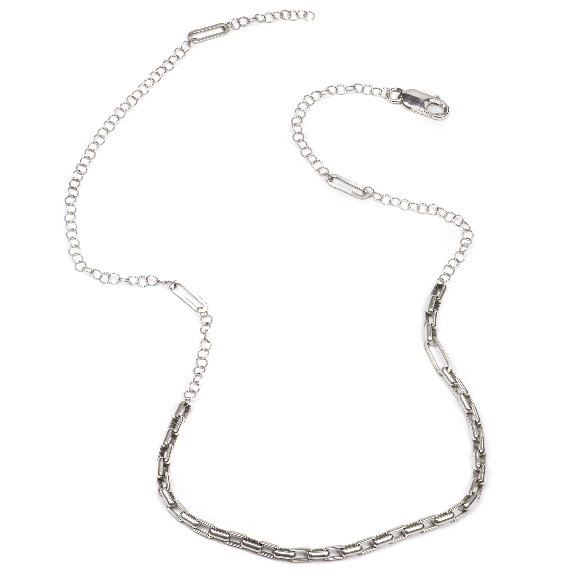 A unique handmade sterling silver chain necklace with varying, asymmetrical links
