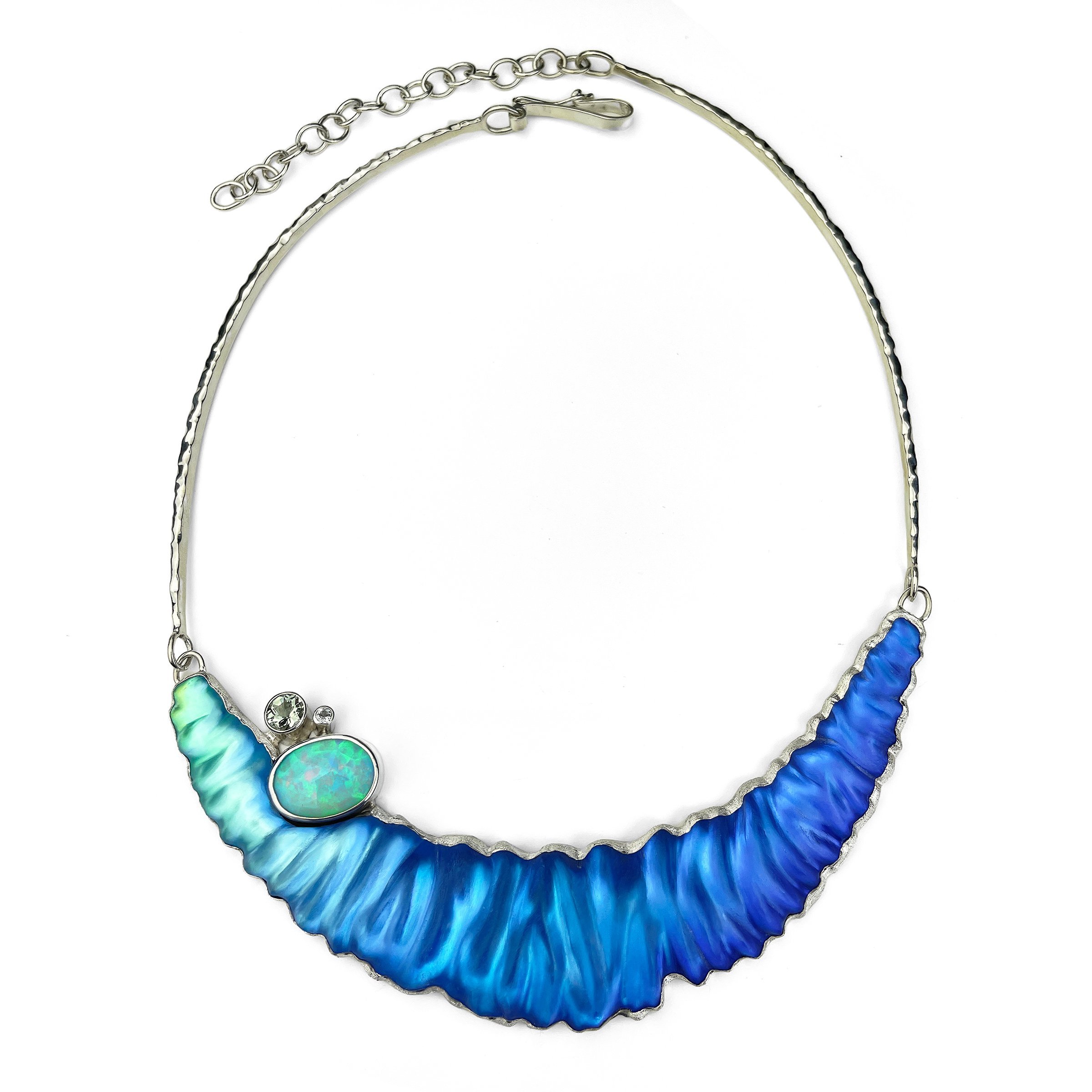 This one-of-a-kind necklace, inspired by the ocean's beauty, features a unique blend of hand-carved glass, sterling silver, and genuine opal and green amethyst.