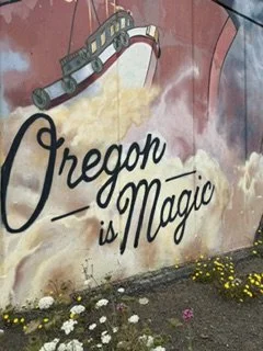 Mural with a boat and the words "Oregon is Magic" written on it.