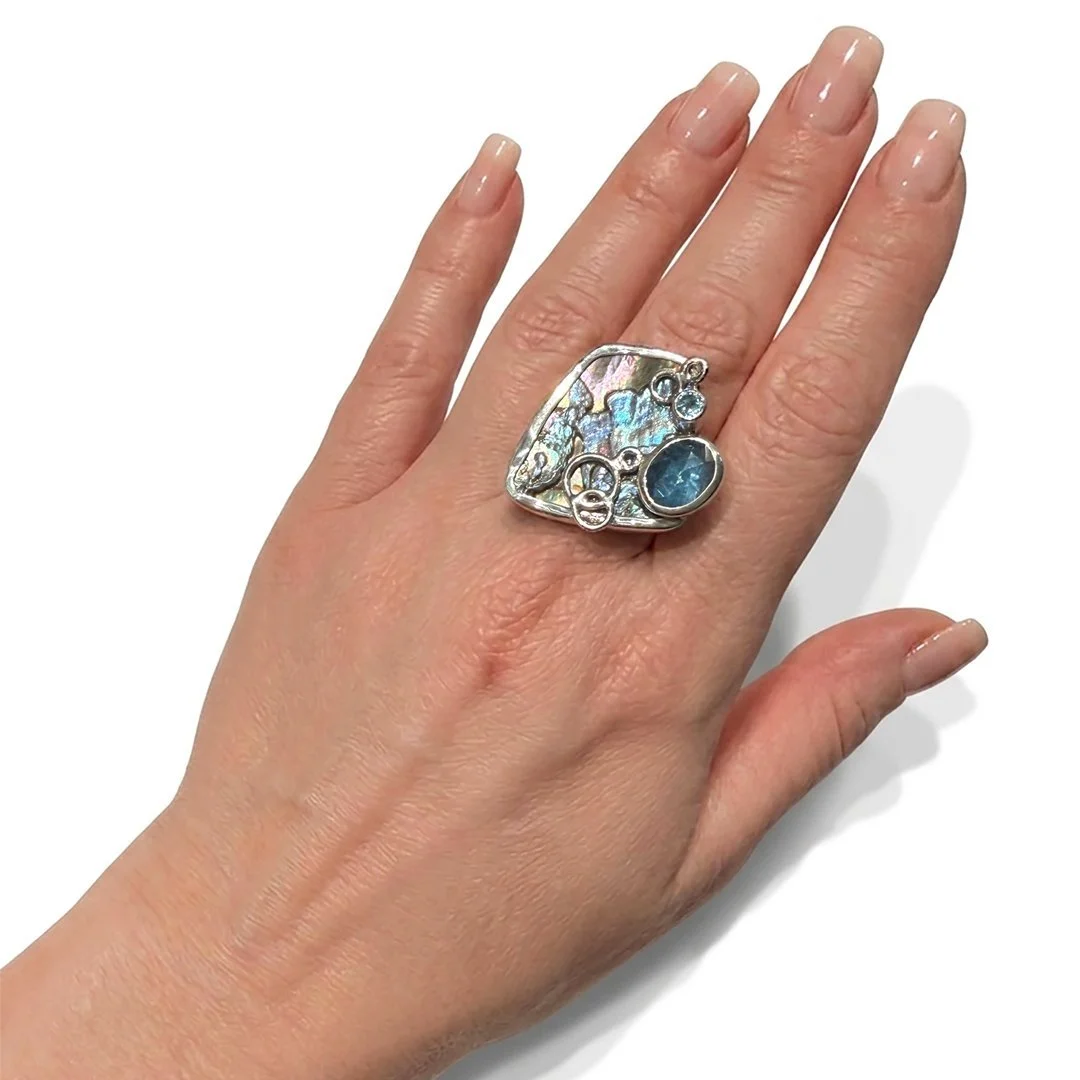 blue-mermaid-ring-kyanite-abalone-topaz-on-model.jpg