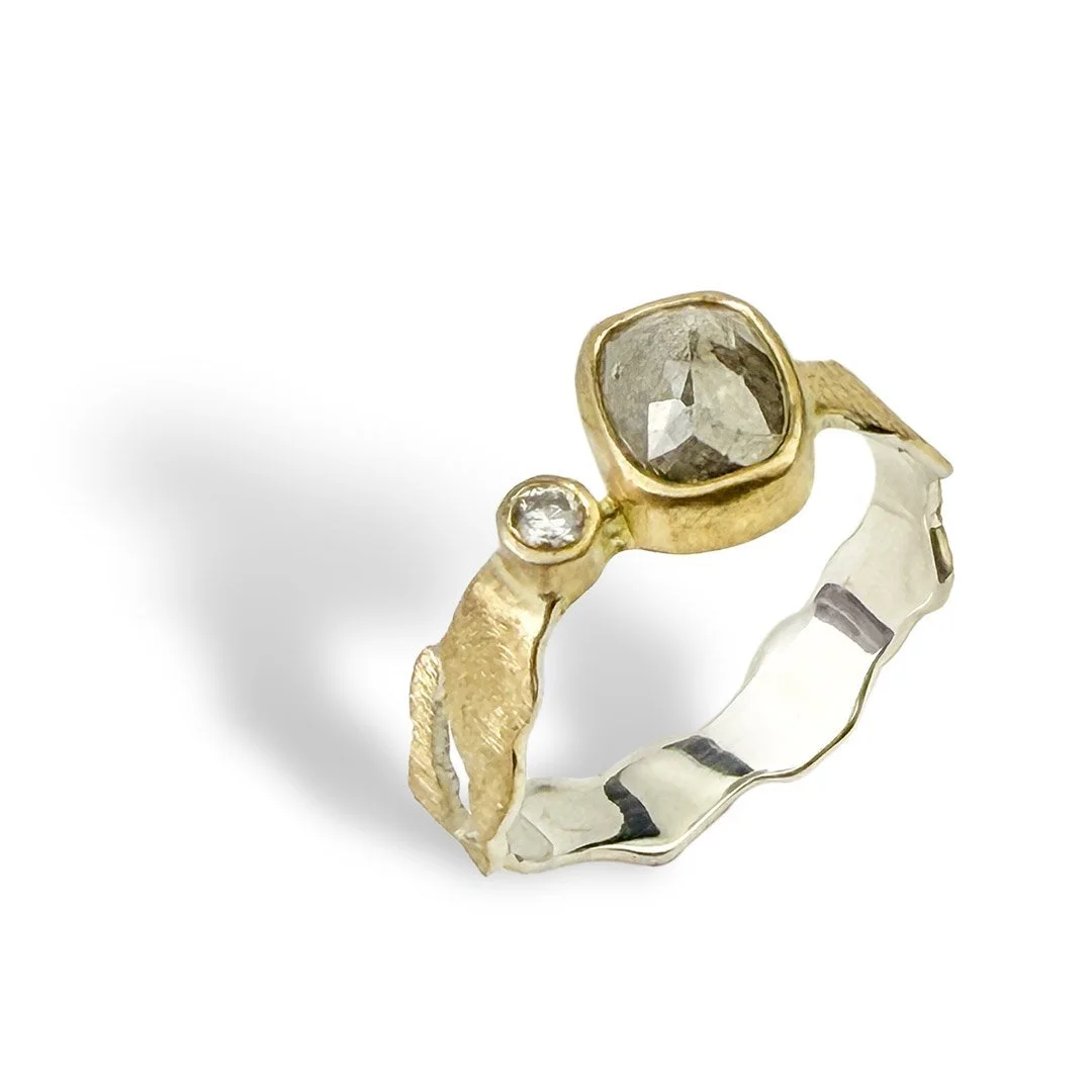 Holding-Light-gold-silver-rose-cut-and-brilliant-cut-diamond-ring-.jpg