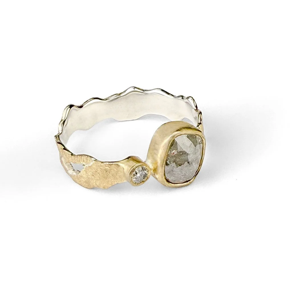 Holding-Light-gold-silver-diamond-ring.jpg