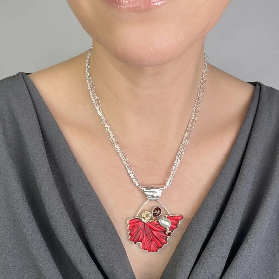 scarlet-flutter-pendant-carved-red-glass-fire-opal-statement-necklace-on-model.jpg
