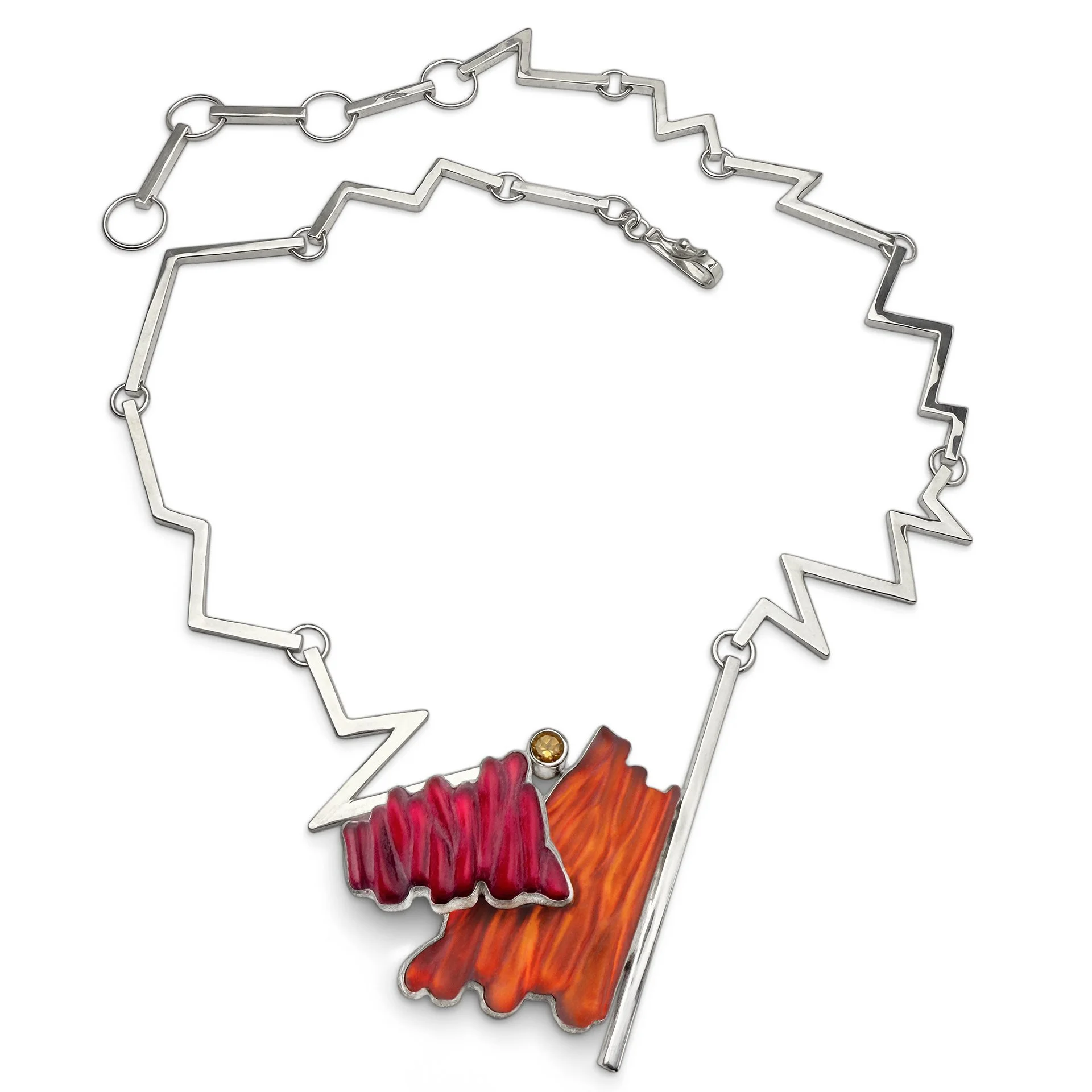 A unique statement necklace made of sterling silver, carved sculptural art glass, and genuine citrine.
