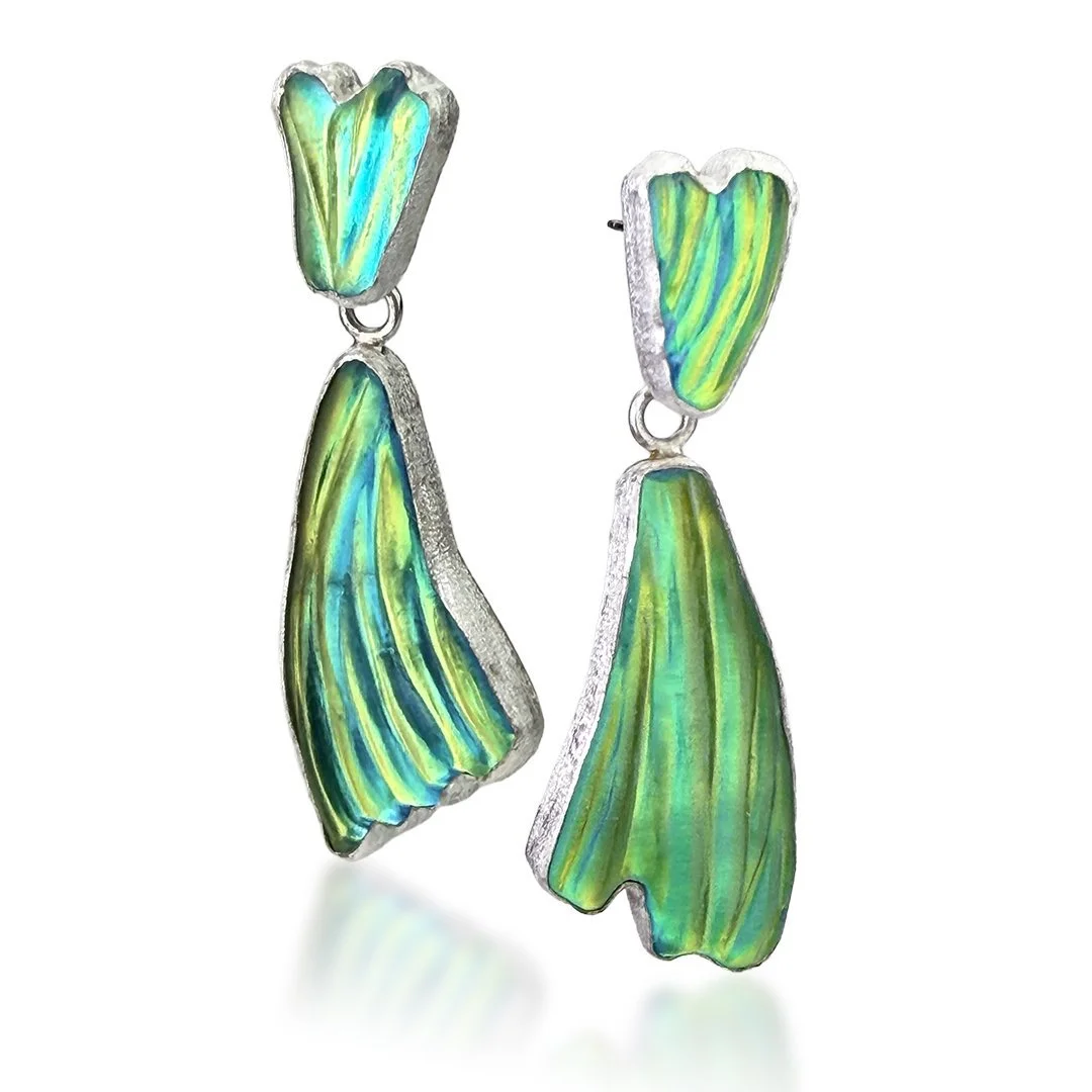 Colorful iridescent earrings with abstract leaf shapes, silver edges, and a drop design.