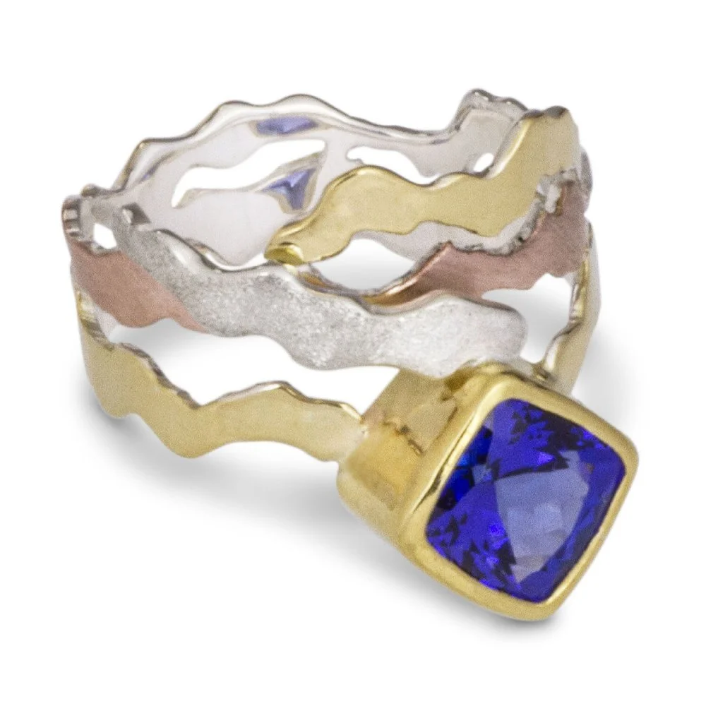a custom 18k and sterling silver ring made with the customer's heirloom tanzanite.