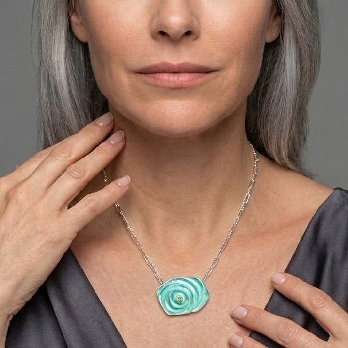 aqua-orbit-ripple-necklace-glass-peridot-on-model.jpg