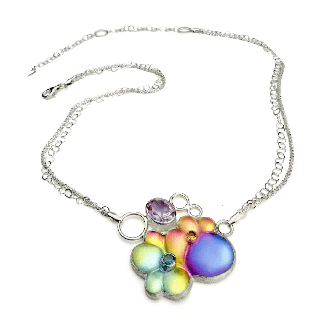 A colorful carved glass and gemstone necklace.
