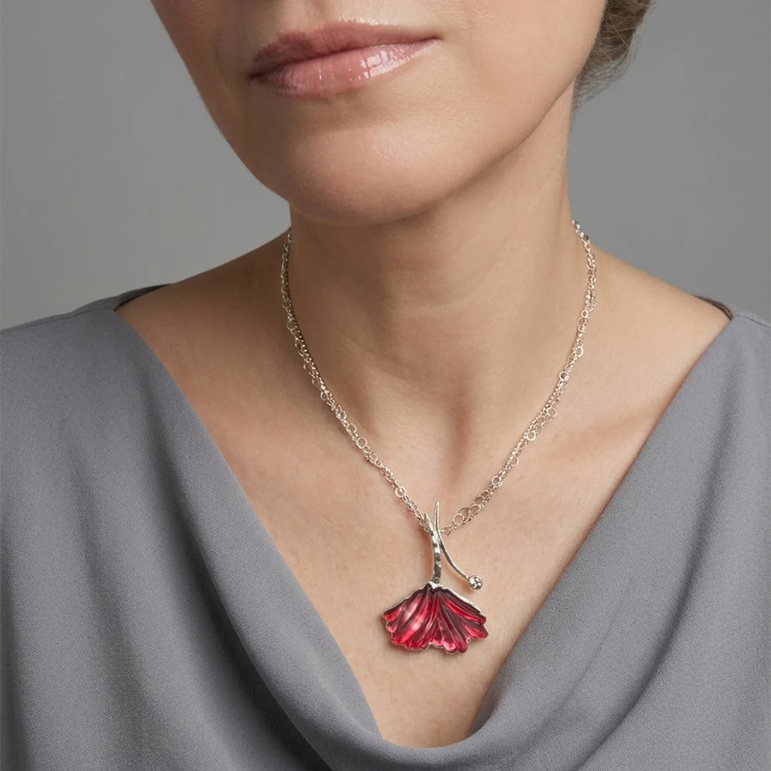 red-bloom-and-bud-necklace-glass-and-topaz-on-model.jpg