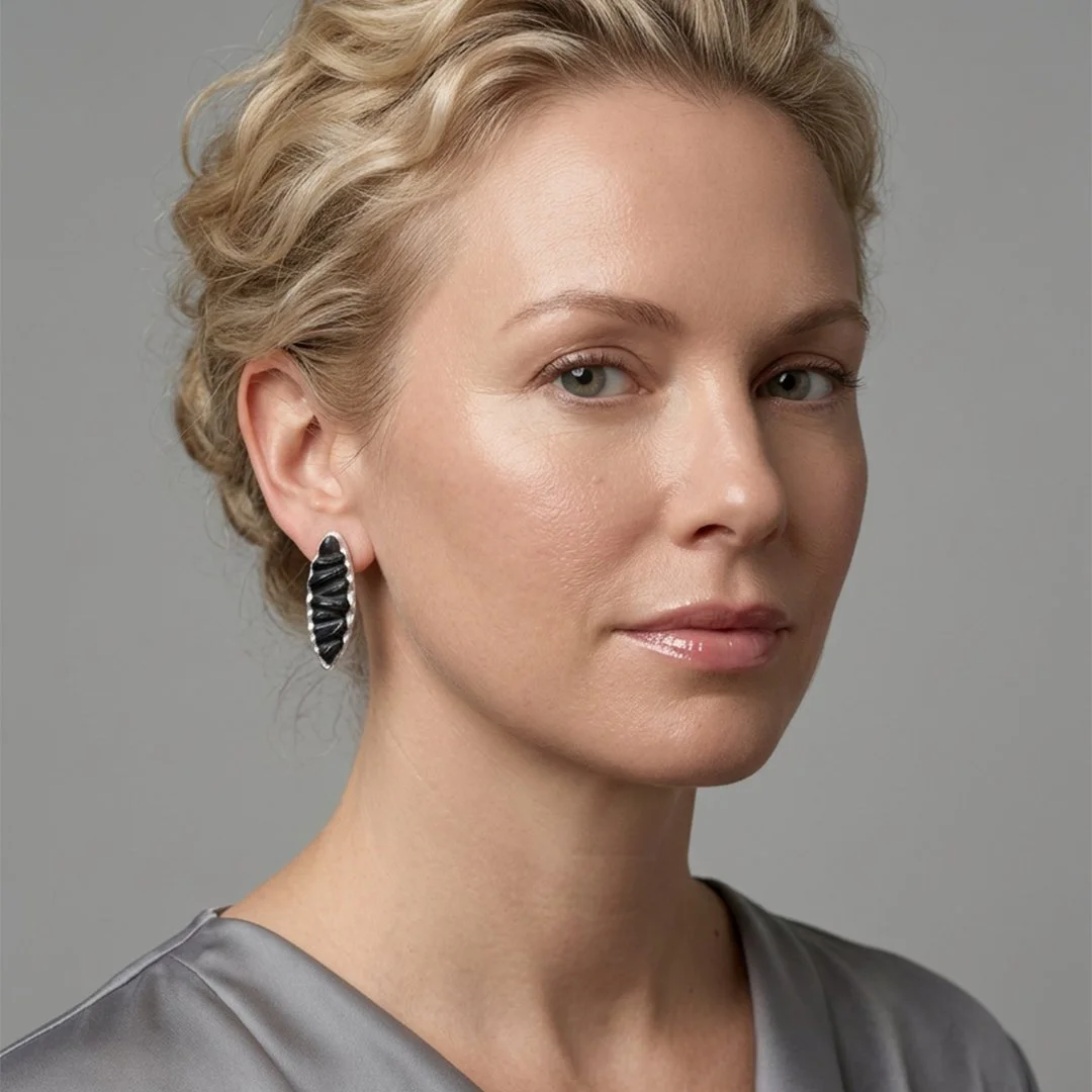 Black-Elliptical-Ripple-Earrings-on-model.jpg