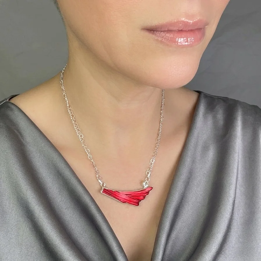 flying-solo-art-glass-necklace-sterling-silver-topaz-on-model-1.jpg