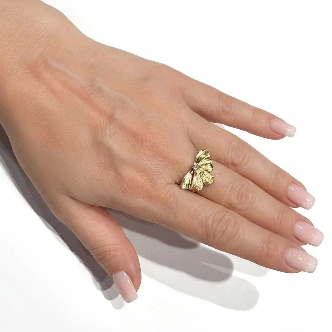 golden-wildflower-18kgold-sterling-silver-diamond-ring-on-model-hand.jpg