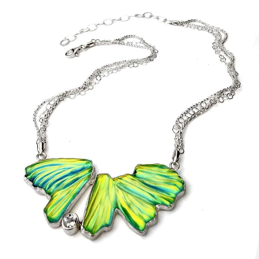 transformation-necklace-carved-green-glass-and-topaz.jpg