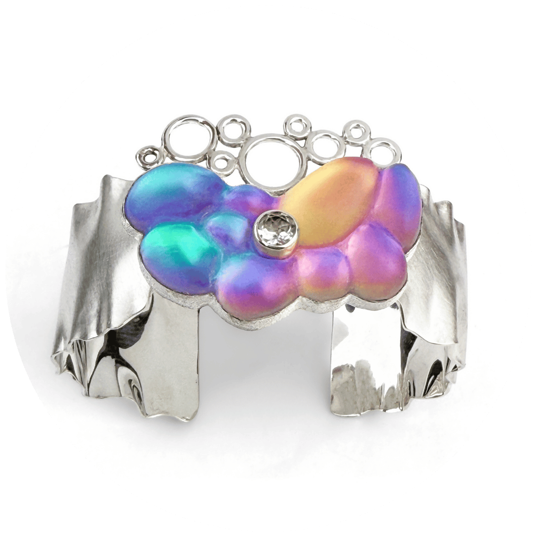 A contemporary, colorful glass and silver cuff bracelet.