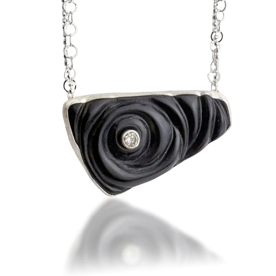 black-orbit-ripple-handmade-glass-necklace-with-topaz.jpg