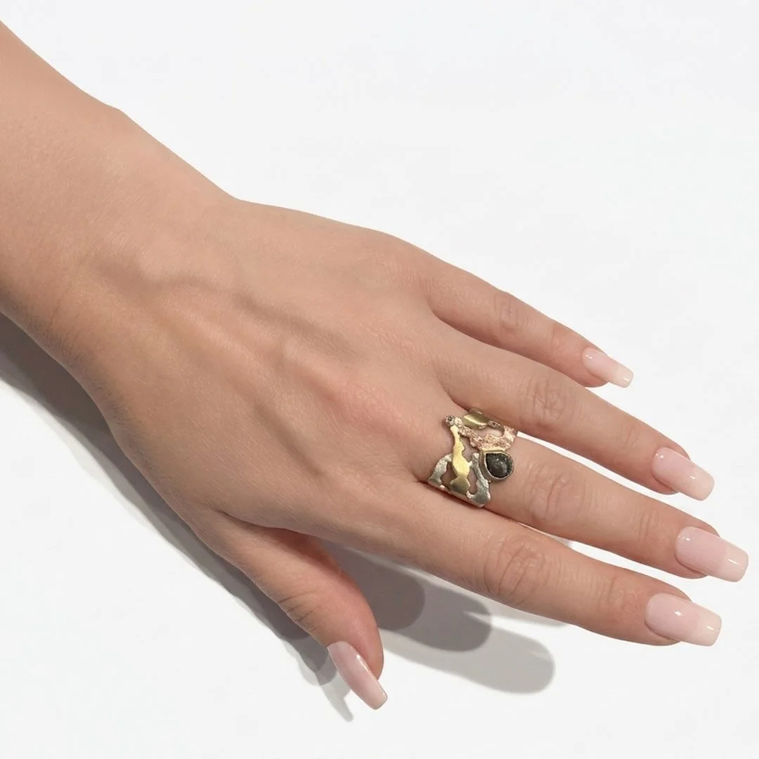 discovery-ring-rose-gold-sterling-silver-yellow-gold-diamonds-on-hand.jpg