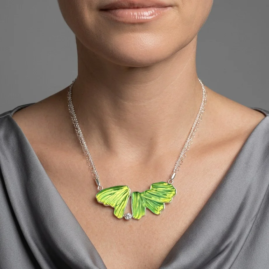 transformation-necklace-carved-glass-and-topaz-on-model.jpg