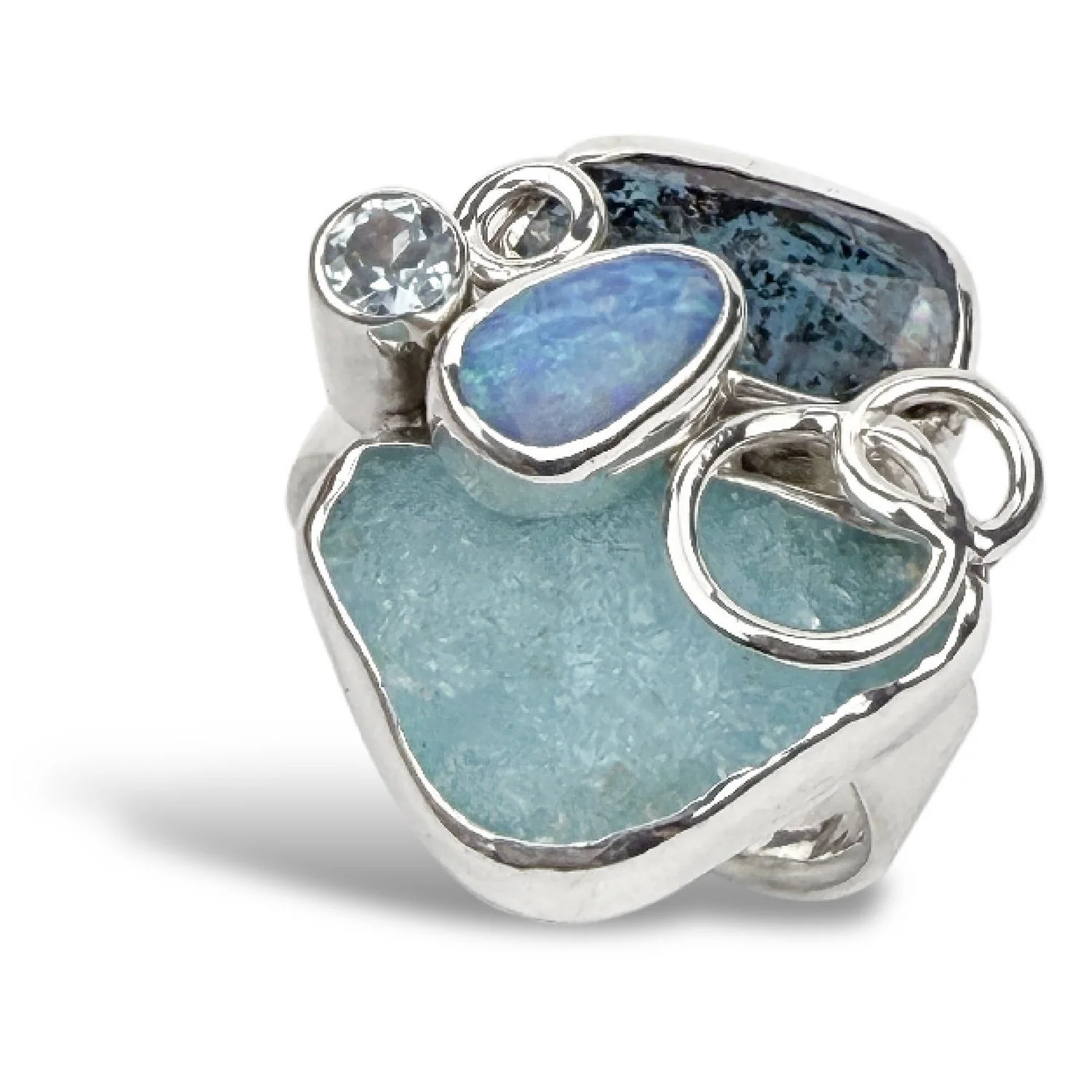 A stunning light blue statement ring with hemimorphite, opal, kyanite, and topaz with sterling silver bubble details.