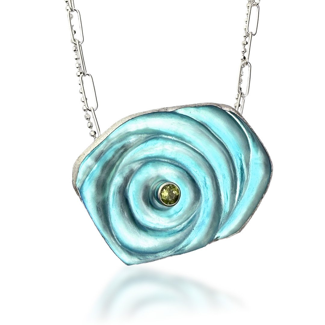 aqua-orbit-ripple-necklace-glass-peridot-hangign.jpg