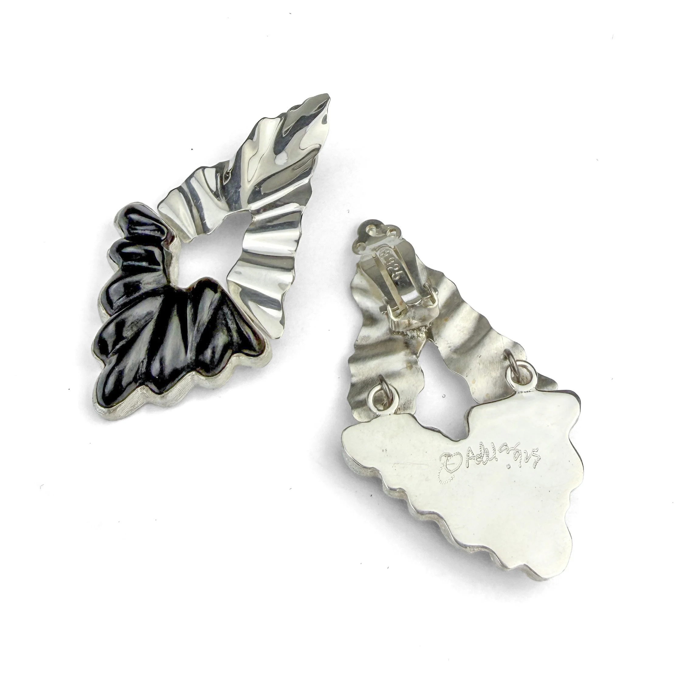 Silver clips earrings with cold-worked black glass and undulating, highly polished sterling silver.