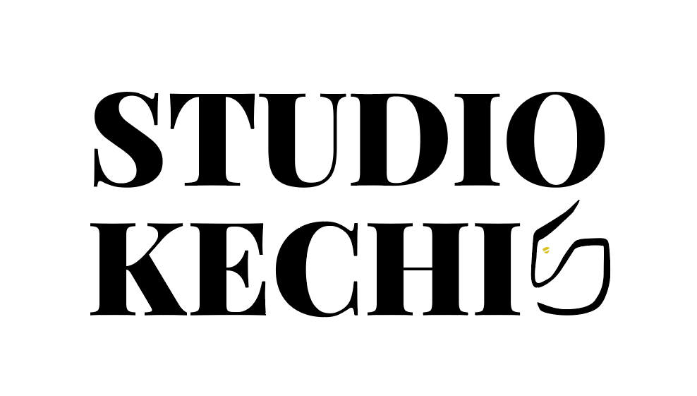Pinar Karaaslan working at her studio desk on a brand identity project.