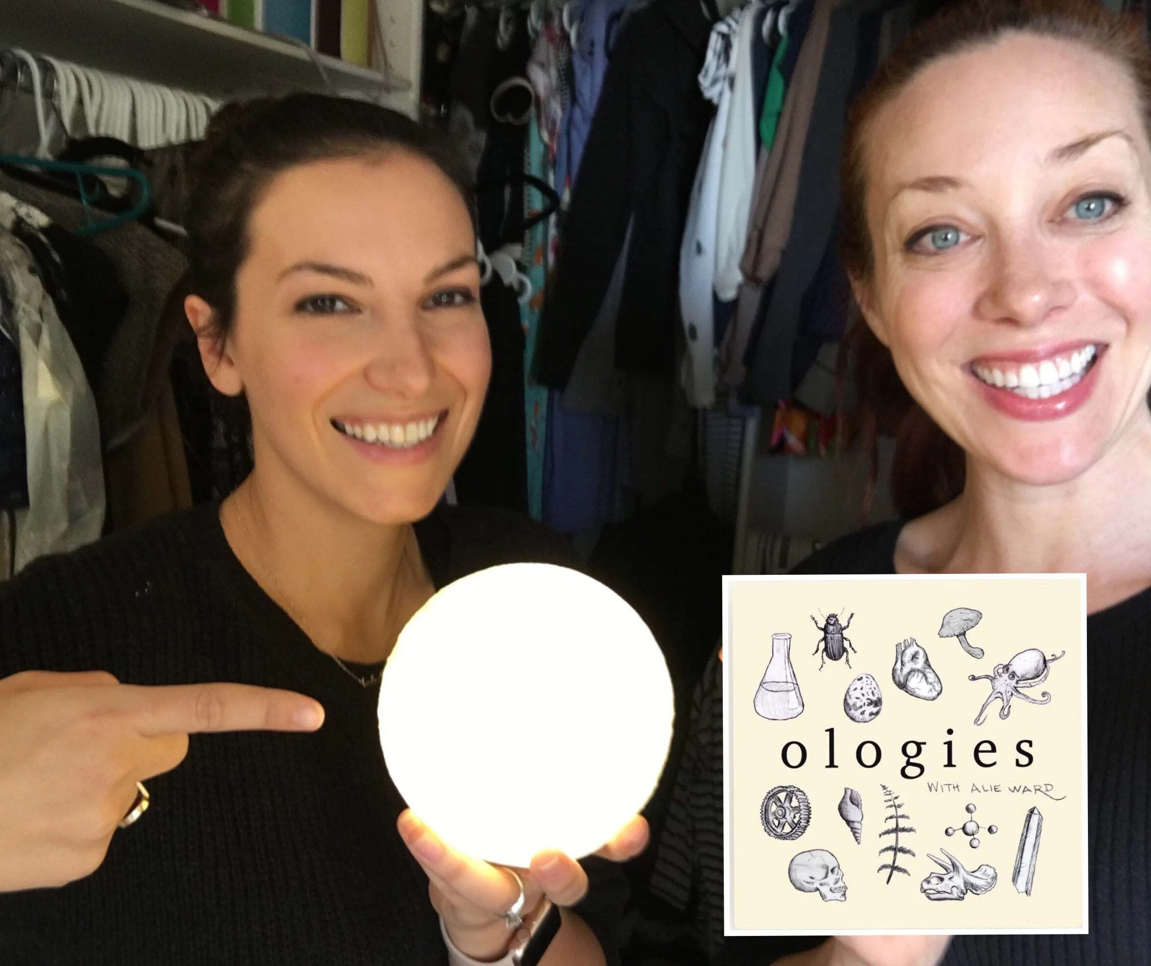 Raquel Nuno holding an illuminated Moon lamp with Alie, standing in Alie’s recording closet.